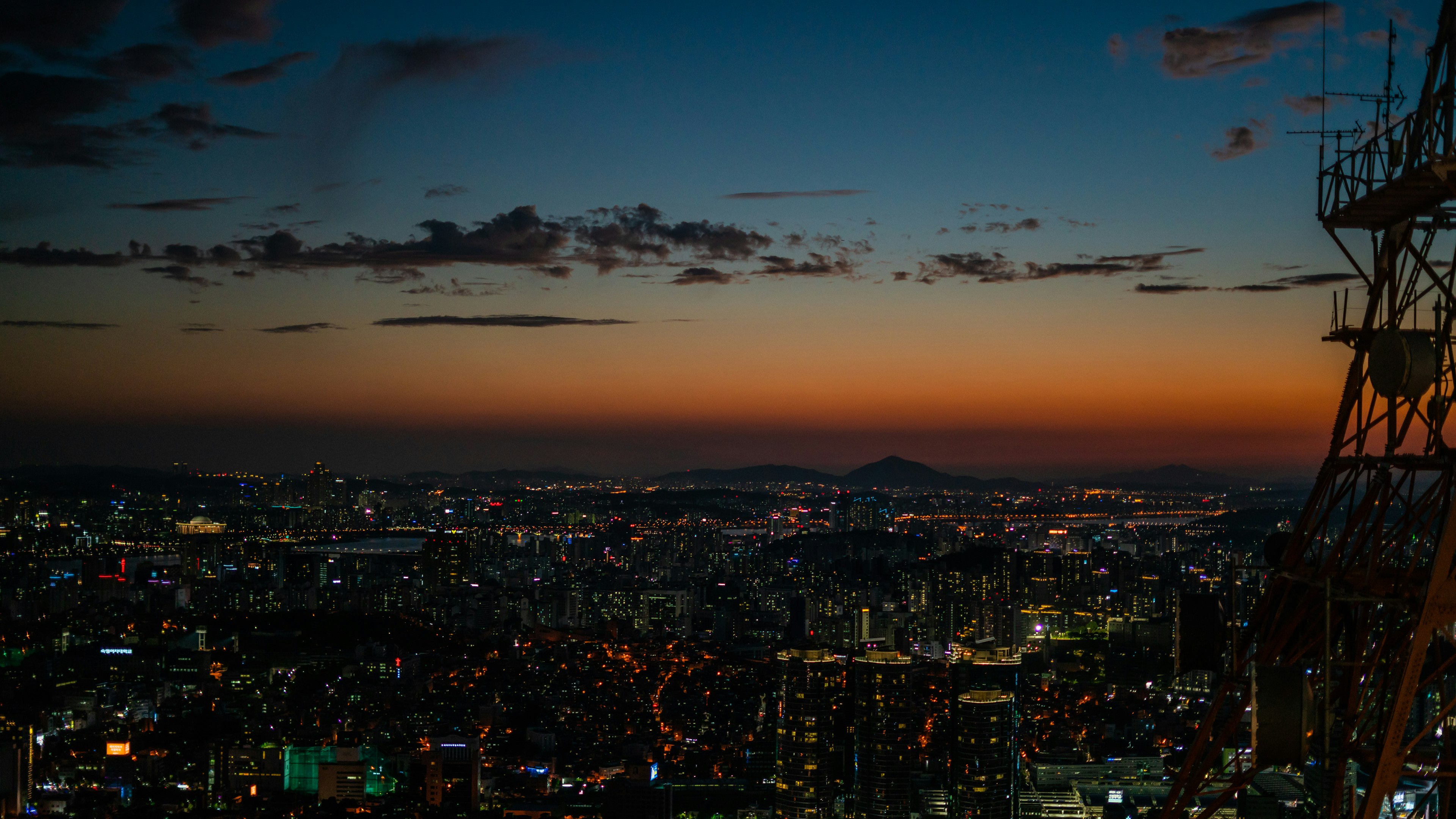 city with high-rise buildings during night time